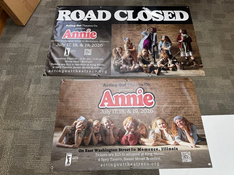 An image of exterior Road Closed signage and Annie the musical signage.